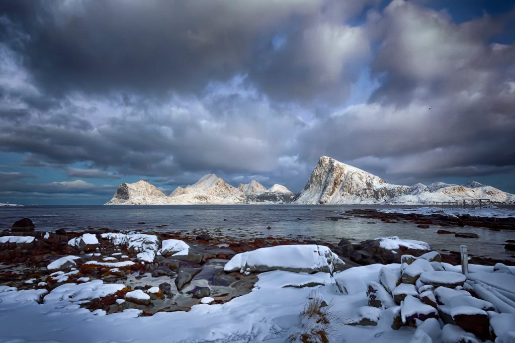 Majestic snow-covered peaks and tranquil seas in the Lofoten Islands, Norway.